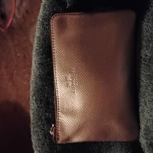 Coach Shimmering Silver Leather Clutches